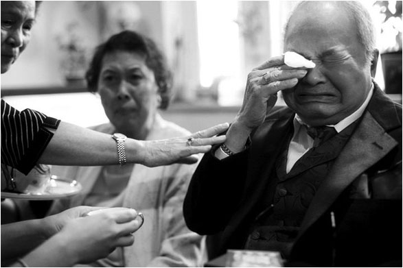 man crying at wedding